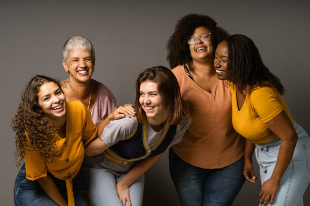 Group of playful women in studio
